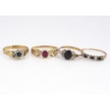 Four 9ct gold gem set rings, including a ruby and diamond ring, two cluster rings and another, 7.2g