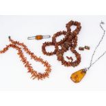 A quantity of organic jewels, including a coral branch necklace, 45cm, a copal amber necklace, 35cm,