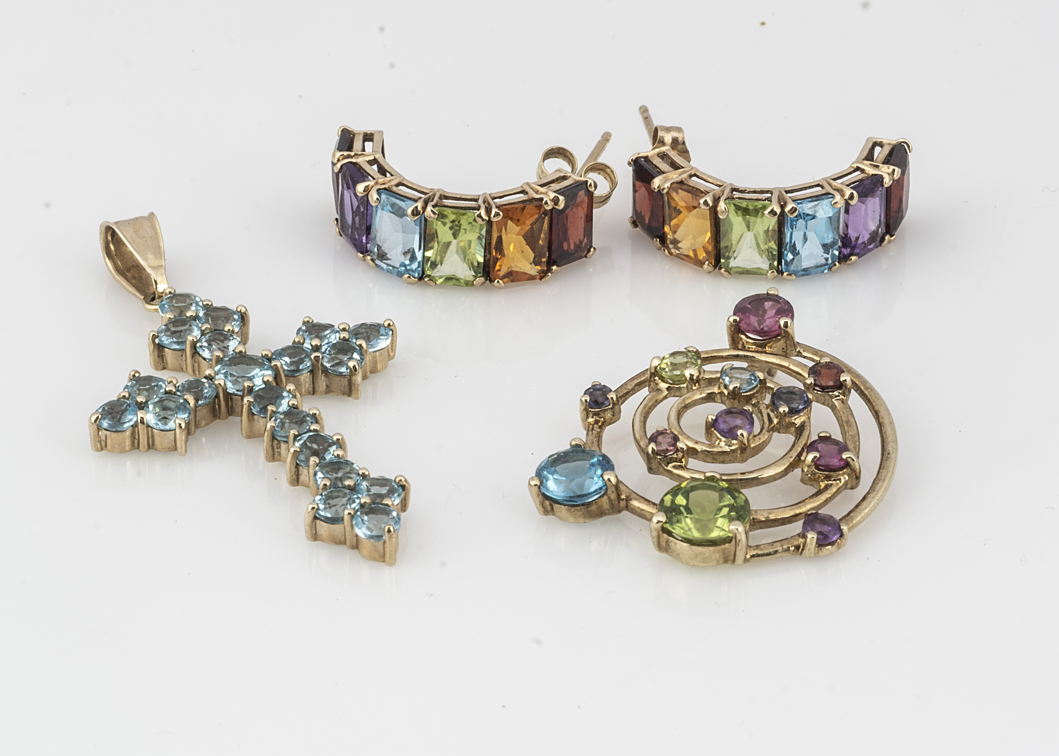 A gem set 9ct gold cross pendant, together with a gem set pierced spiral pendant, and a pair of