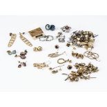 A quantity of gold earrings, and others, including eighteen pairs and some loose of studs, drops,