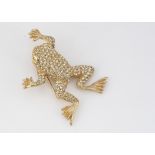 A Christian Dior frog brooch, encrusted with paste set gems, having pin back, 5cm x 3.5cm, 12.4g