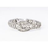 A diamond and white metal Art Deco style open worked bracelet, set with old cut diamonds, open