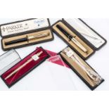 A pair of Parker fountain pens, together with a gold plated Parker biro and pencil, each boxed,