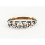 A five stone antique diamond dress ring, the cushion cuts mounted in silver on a later shank