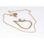A 14ct gold curb link necklace, 30cm together, and an oval link bracelet, 20.5cm, 9g (2)