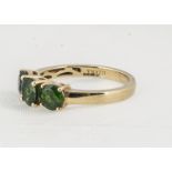 A contemporary Iliana 18ct gold green chrome diopside three stone dress ring, ring size O, 3.7g