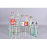 A collection of Motor Oil glass bottles, including Shell X-100, BP Energol, Castrol, Esso Lube and