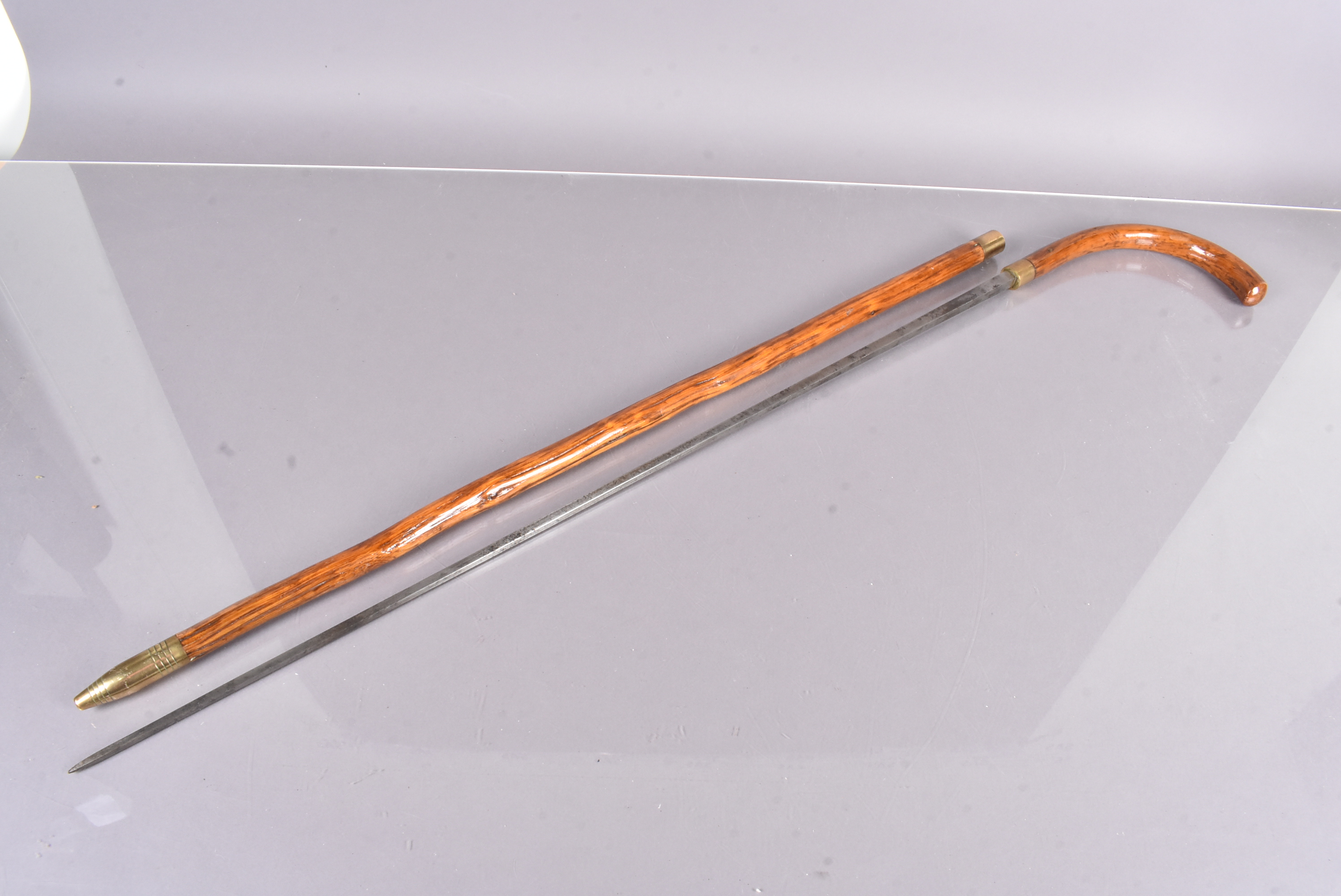 An Antique sword stick, with four sided 75cm long blade