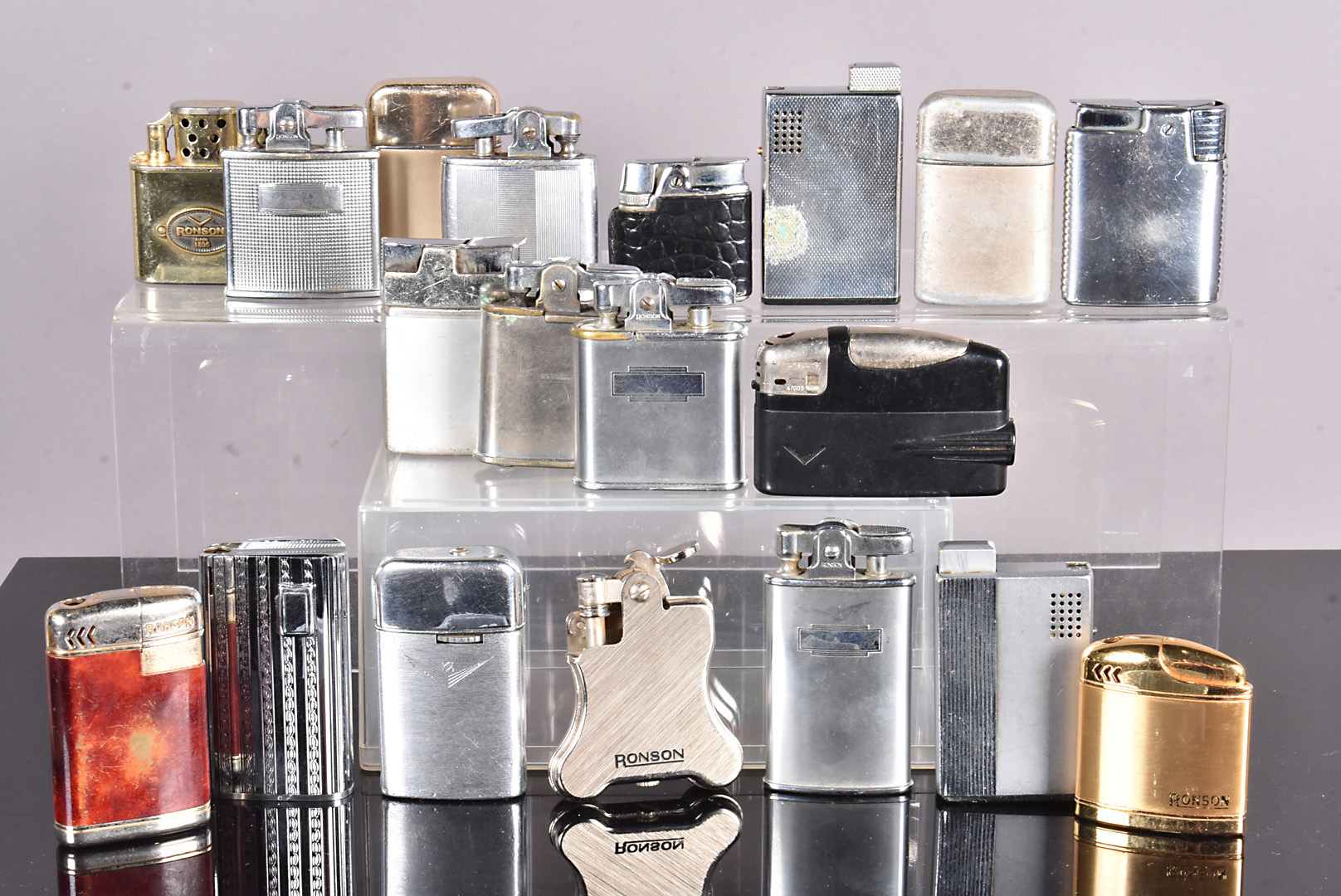 An assortment of various Ronson pocket lighters, to include a Zippo style example, Typhoon,