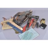 An assortment of various items, to include an axe and carrier, a pair of 1950s gators, a Solingen