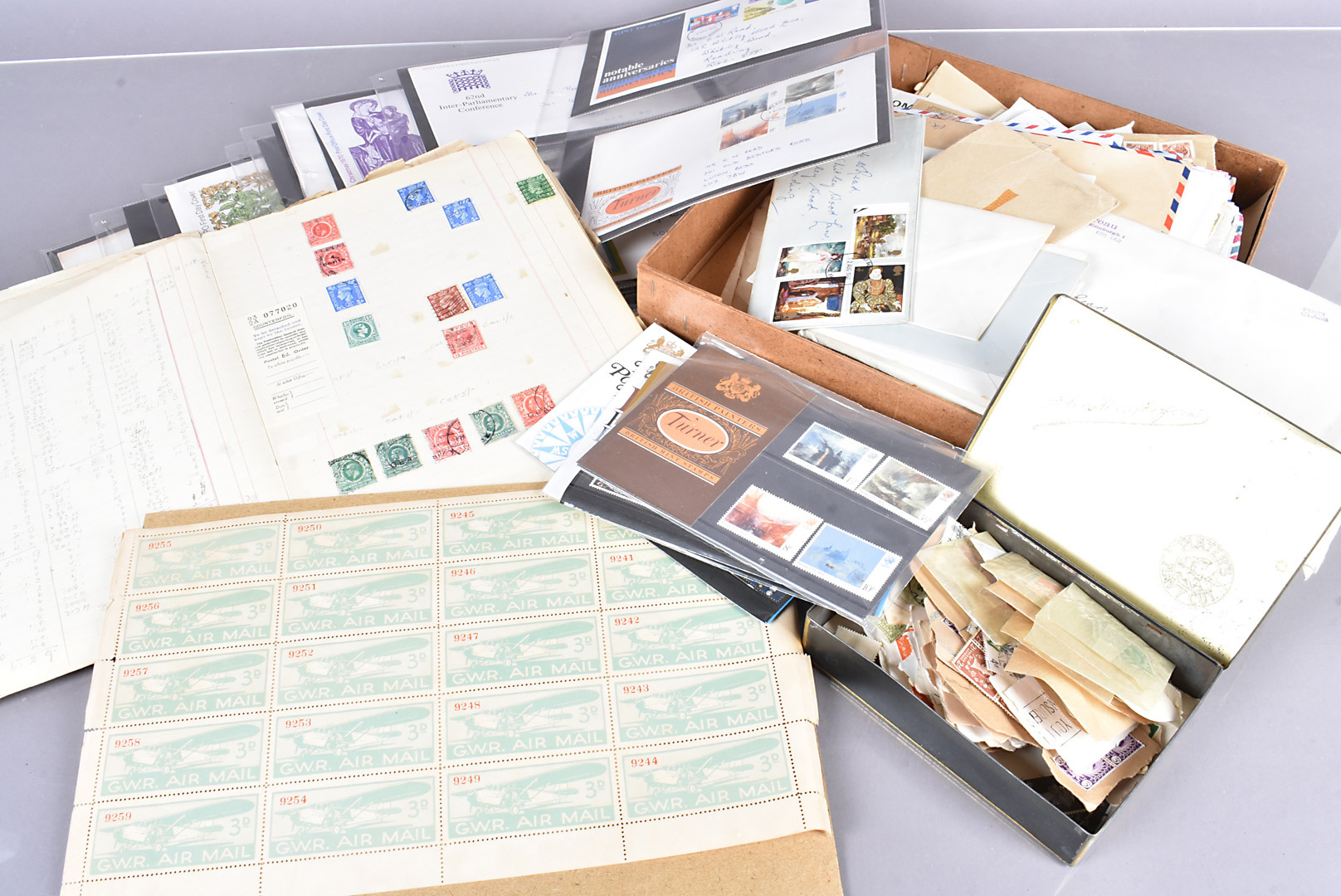 A collection of loose stamps and FDCs, including a sheet of GWR Airmail stamps, British and Overseas