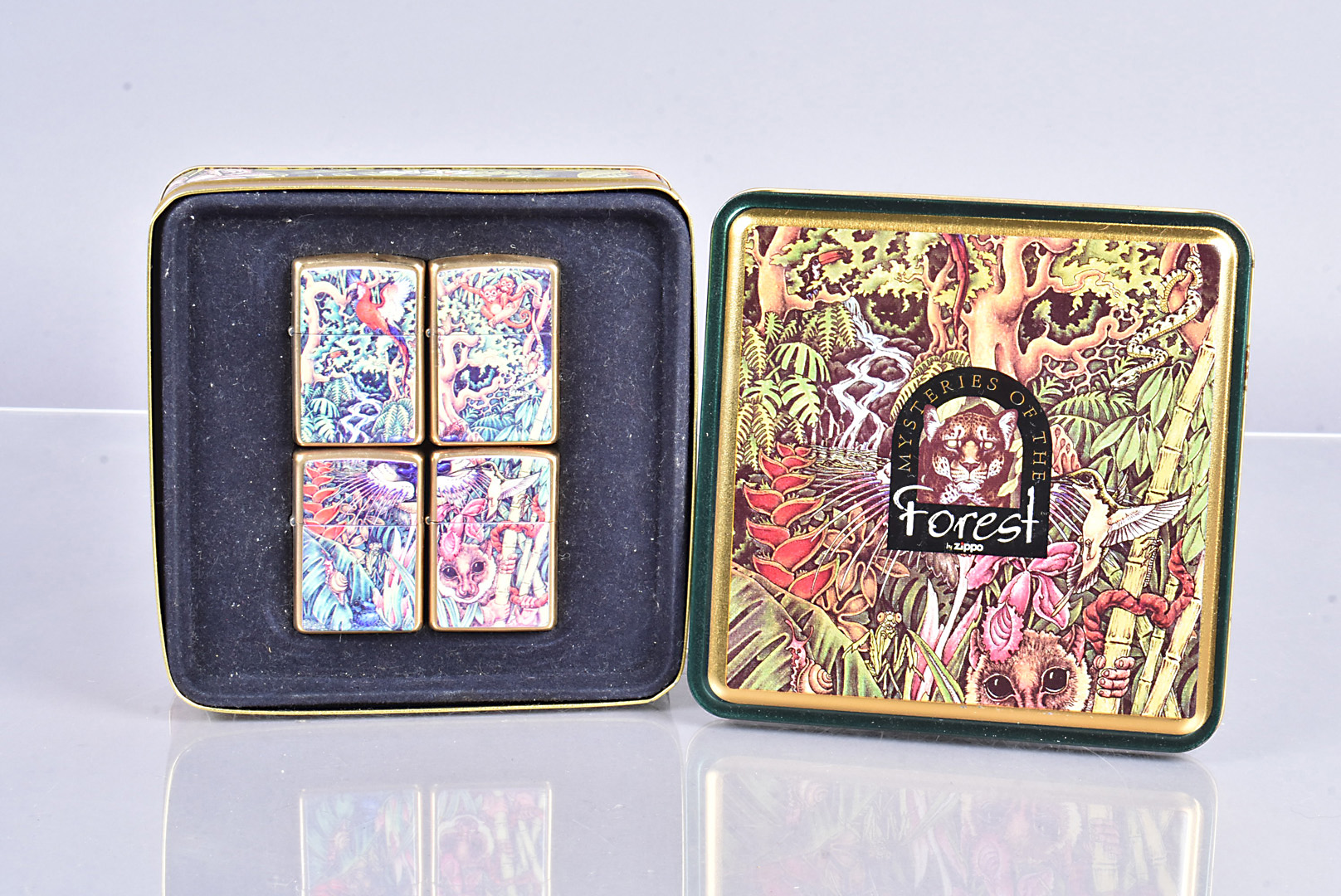 Mysteries of the Forest, cased set of four Zippo lighters, dated 1995, the four lighters each