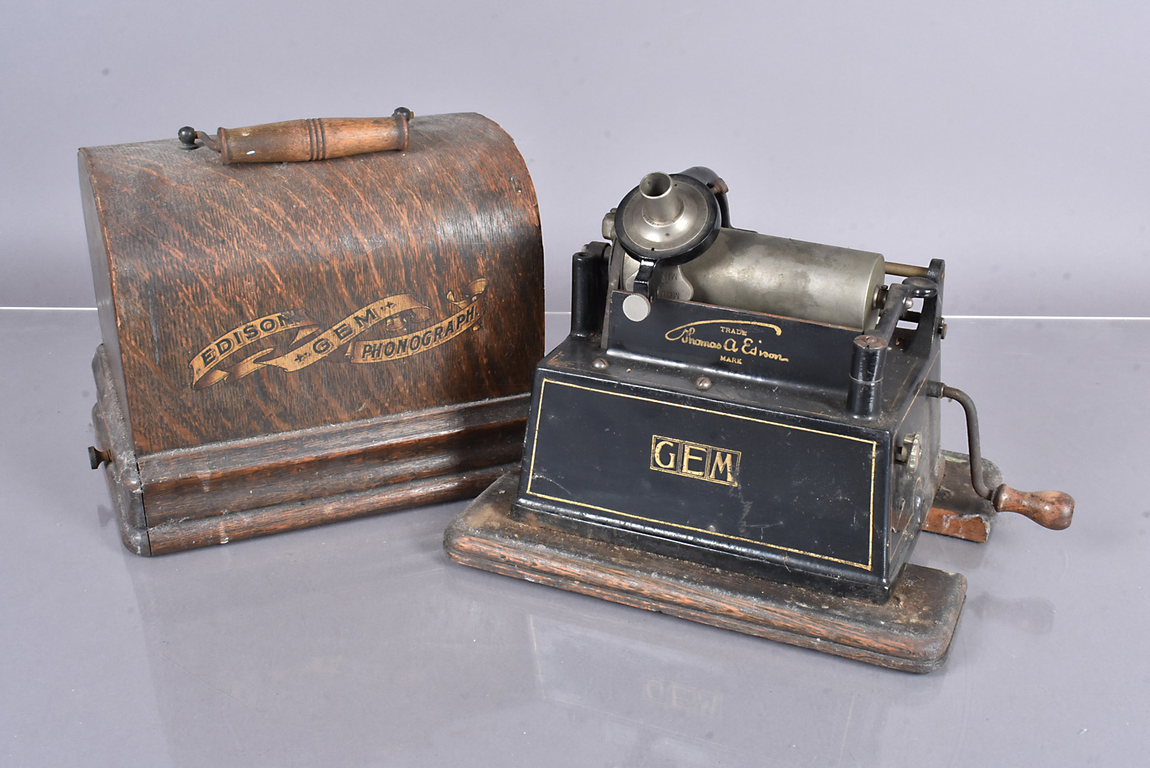 An Edison Gem phonograph, with Model H reproducer, black finished body with transfers, lacking horn