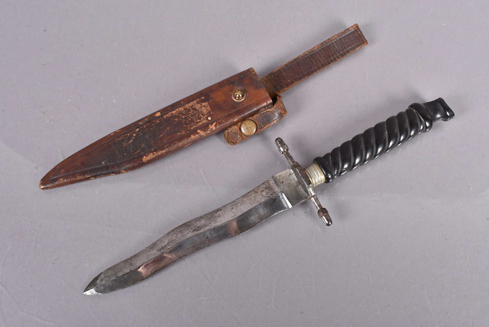 A Linder Kris Snake dagger, with 15cm long double edged wavy blade, with acorn terminals to the