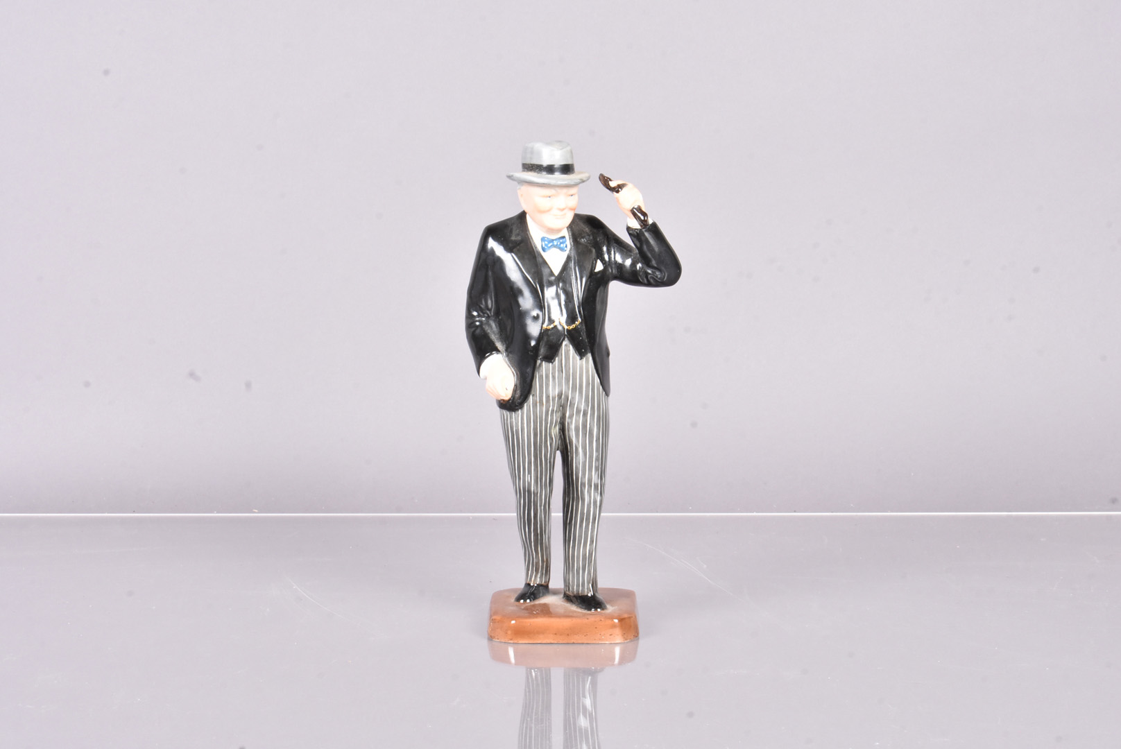 A rare Copeland Spode figure of Churchill, modelled by Eric Olsen, Churchill donning his signature