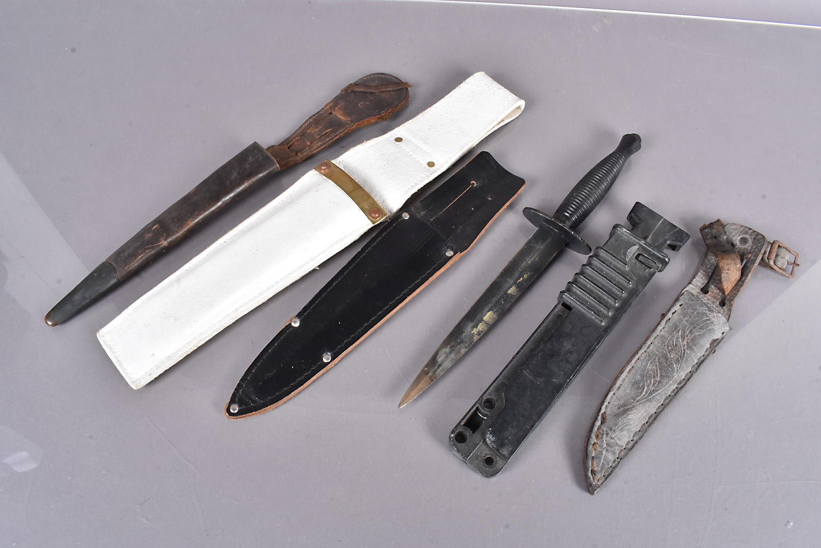 A Post War Fairbairn Sykes fighting knife, together with a 3rd Pattern FS knife scabbard, SA80