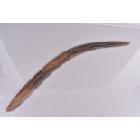 An Australian Boomerang, with hand carved decorative design, with the name Peter, 77cm diameter