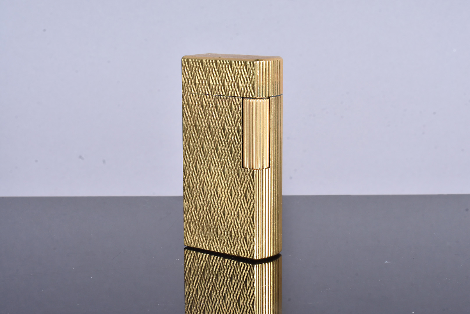 A Dunhill 70 gold plated lighter, serial CX467, also stamped C, and marked Patented, with engine