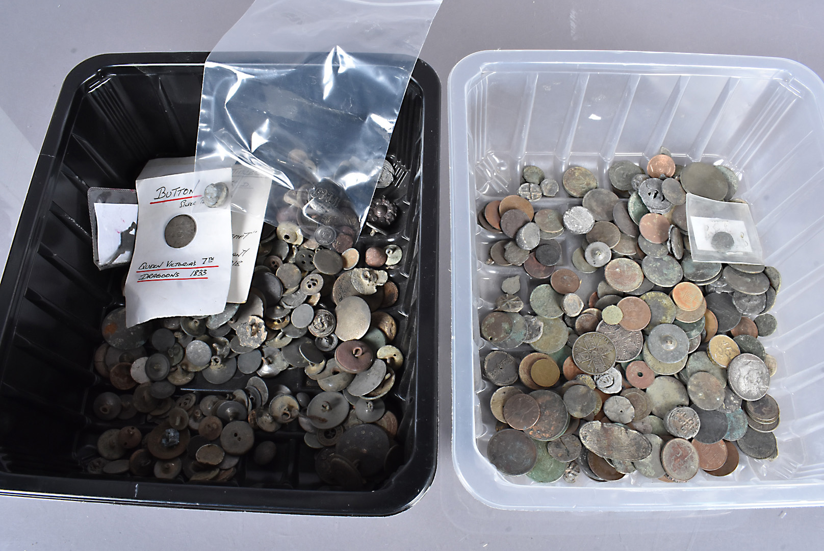 An assortment of 16th Century and later tokens and buttons, including coins, including a 16th