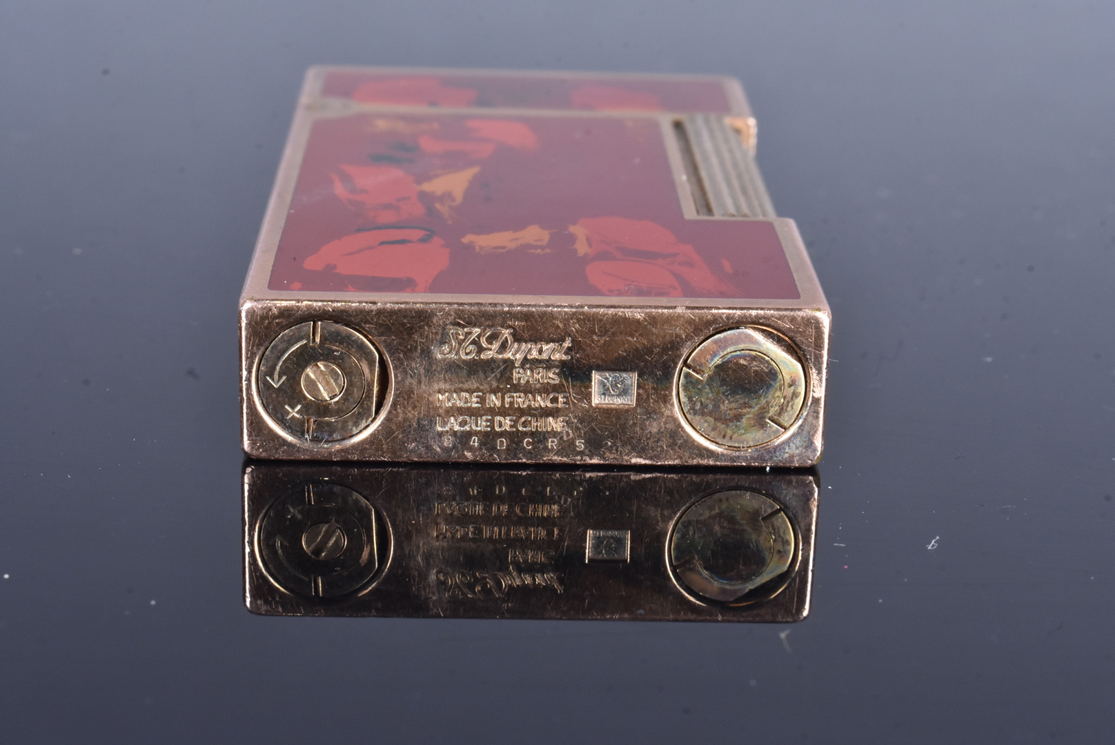 A Dupont gold plated and lacquered pocket lighter, serial 84DCR52, with red marble lacquered panels, - Image 3 of 4