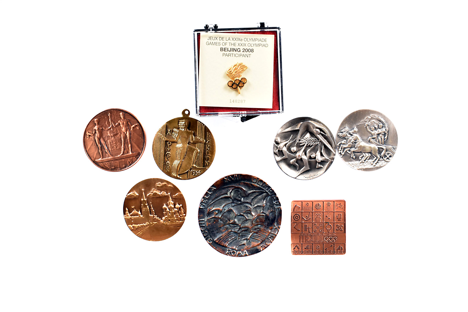 A selection of smaller Olympic Participation medals, to include Amsterdam 1928, Berlin 1938,