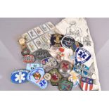 An assortment of Red Cross and St John Ambulance related items, including silver plated paperweight,
