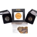 Two 2012 London Olympic Commemorative medallions, in fitted presentation cases, together with a FIFA