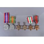A selection of unattributed WWII medals, comprising Defence, War, 1939-45 Star, Africa Star, Italy