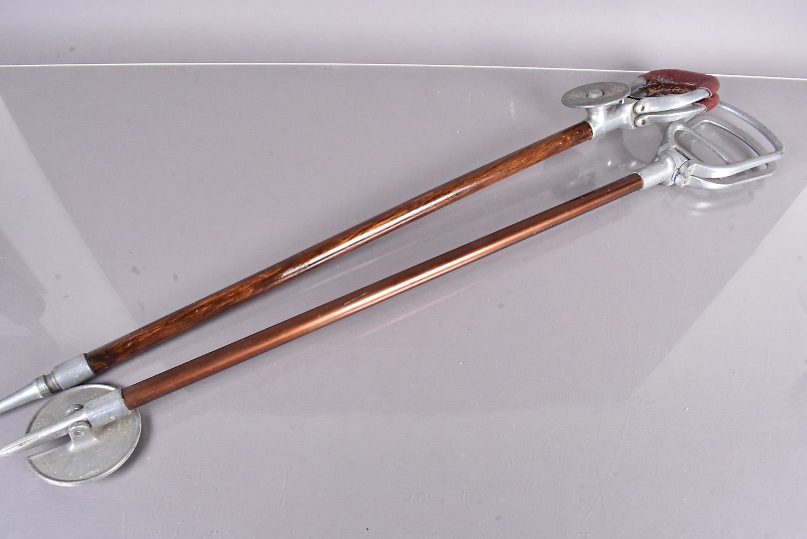 A Mills Munitions Ltd 'Tourist' shooting stick, with leather cover to the handles, with wooden