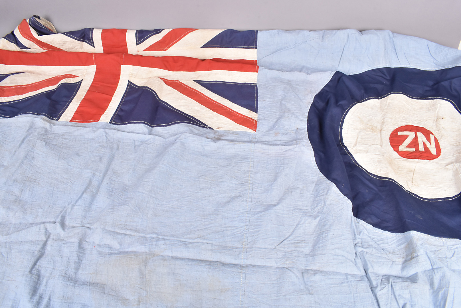A WWII period Royal New Zealand Air Force (RNZAF) flag, dated 1943, with NZ and broad arrow, NZ