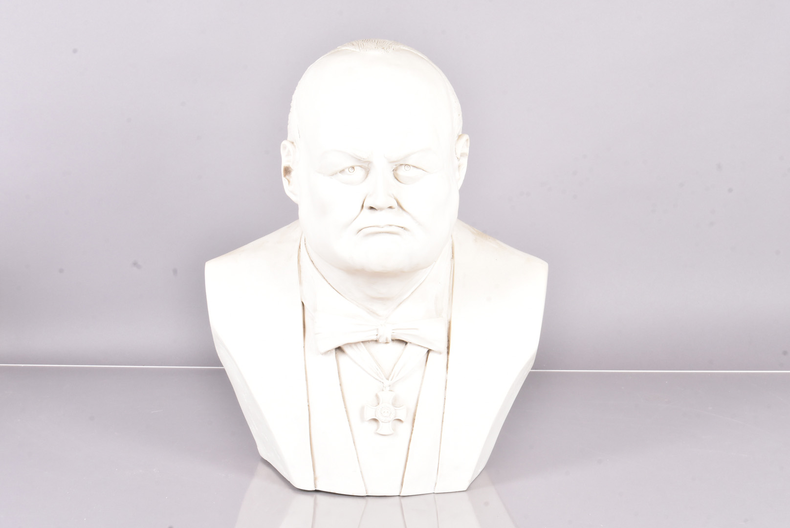 A large reconstituted faux alabaster bust of Sir Winston Churchill, stamped Copyright H.W UK to