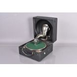 A Decca 'bowl-in-lid' Portable gramophone, with typical reflector dish horn in lid, Decca