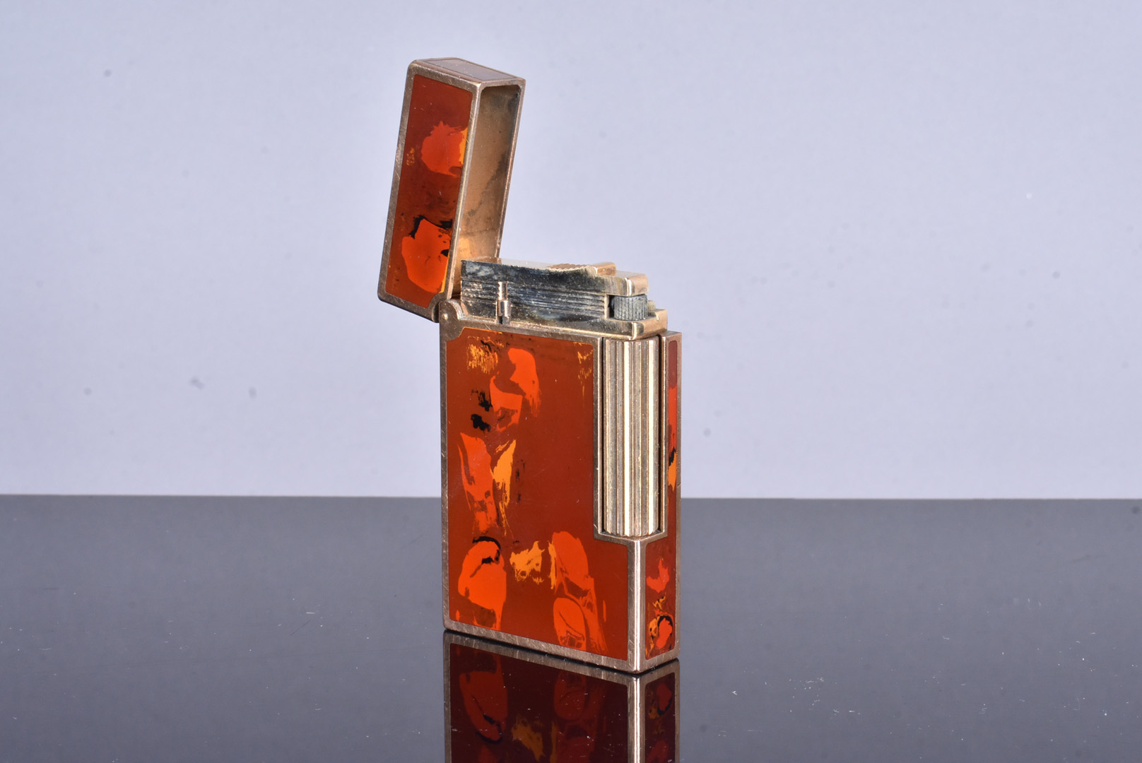 A Dupont gold plated and lacquered pocket lighter, serial 84DCR52, with red marble lacquered panels, - Image 2 of 4