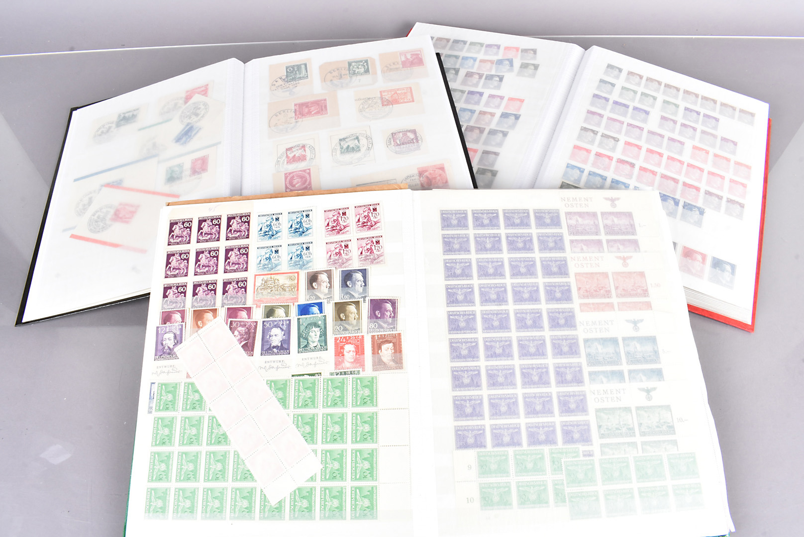 An assortment of German and Third Reich Postage stamps, in four well presented albums and loose,