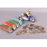 A vintage tin plate motorbike and sidecar wind-up toy, together with four EFE coach models, plus a