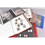 An assortment of Victorian and later GB and World stamps, including a number of Penny Reds from