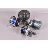 A group of four fishing reels, to include a Shakespeare Golden Eagle, Abu Garcia Ambassadeur 5501-