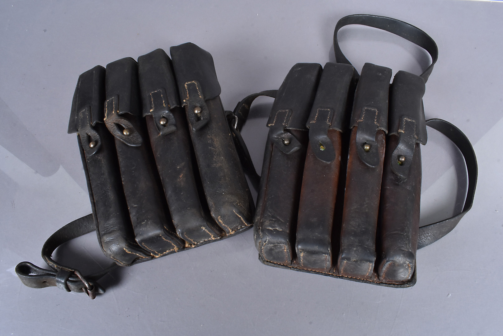 Two Yugoslavian/Czech M56 SMG leather magazine carriers, one marked with a Star to the reverse, both