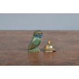 A small early 20th century painted bronze owl, with glass eyes, three Greek symbols, 3cm high,