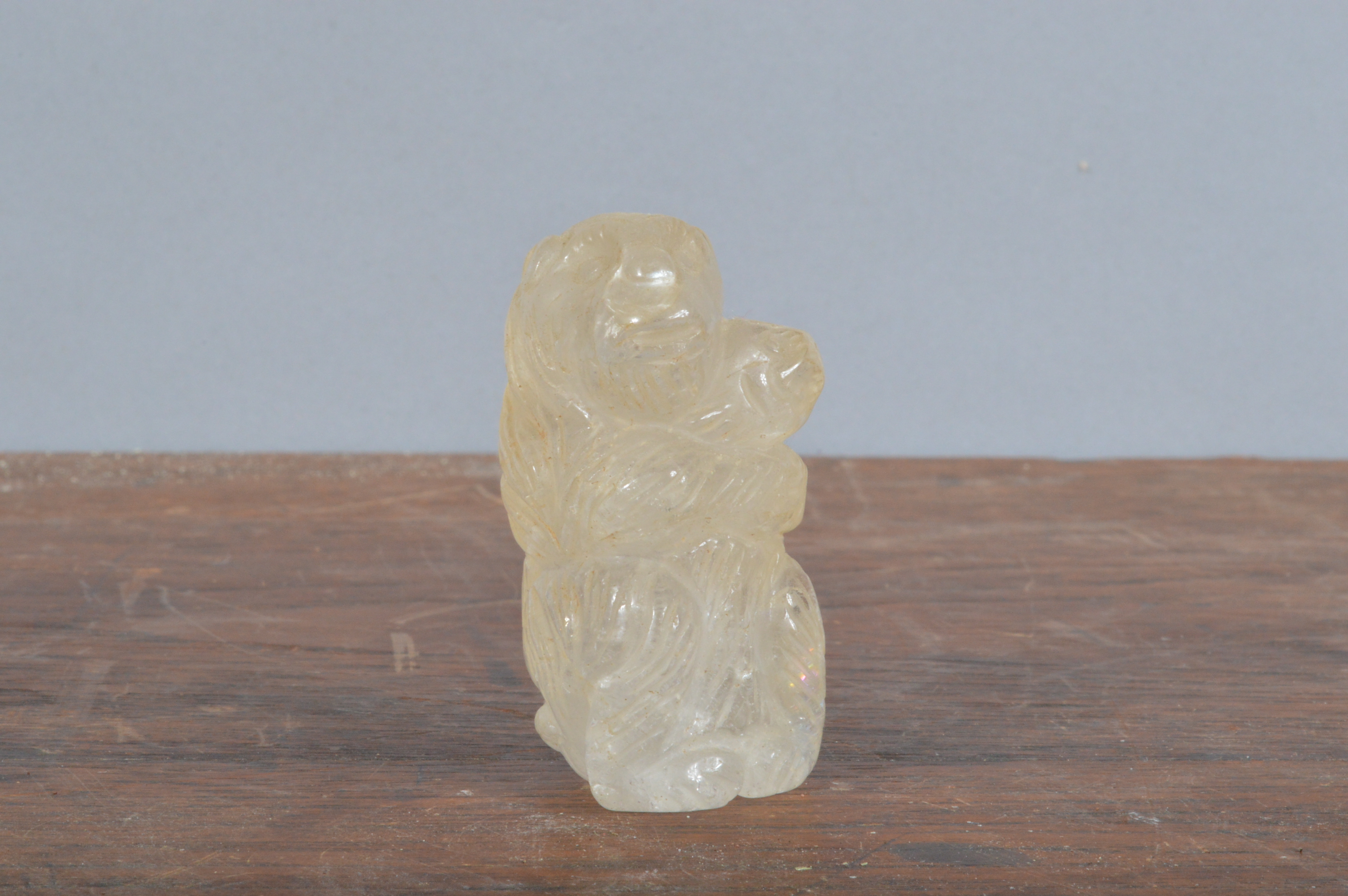 A finely-carved rock crystal bear, standing up holding its cub. 5 cm tall. (1)