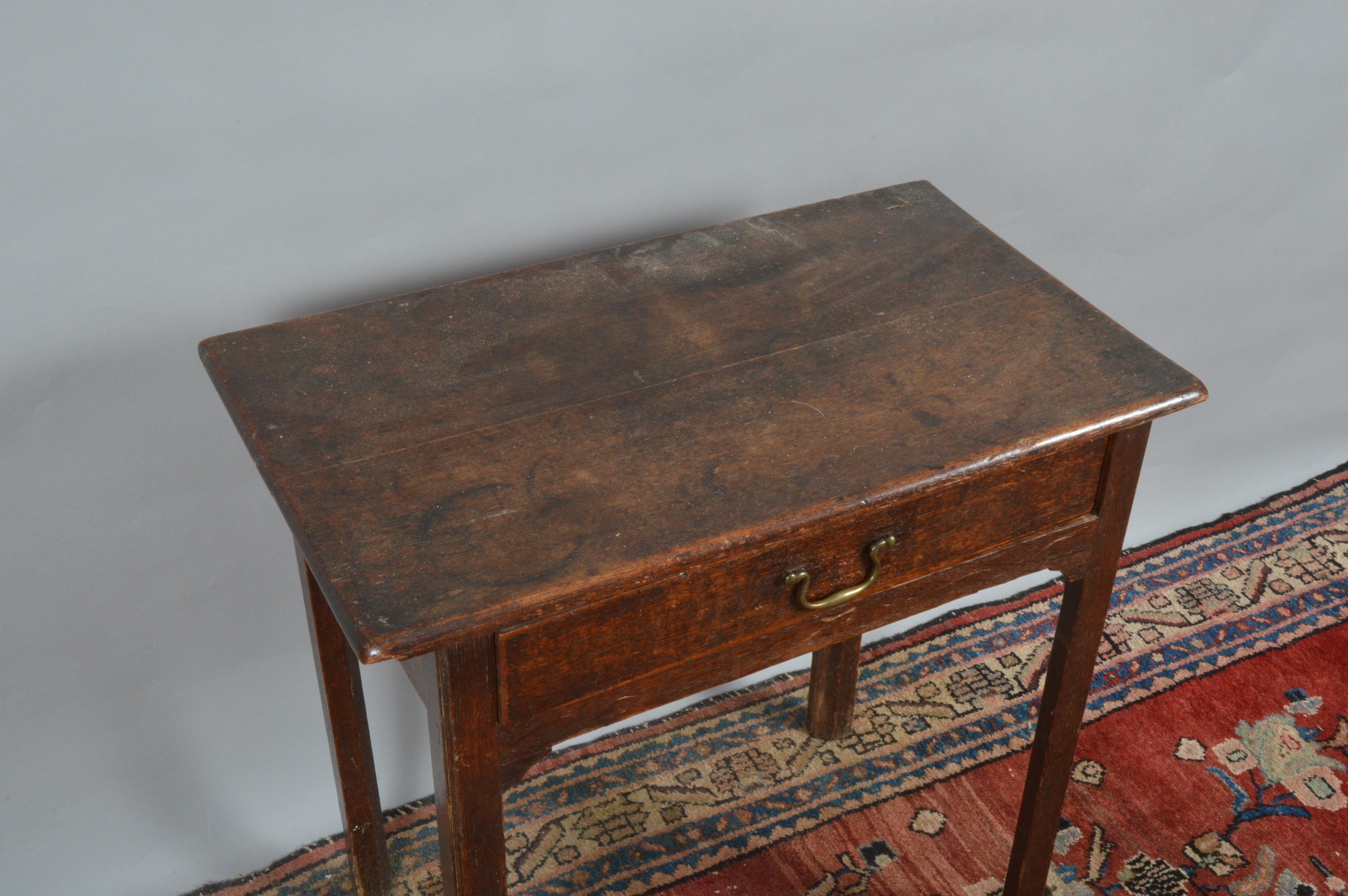 A George III oak side table, single drawer frieze, with drop handle, raised on four slender - Image 2 of 2