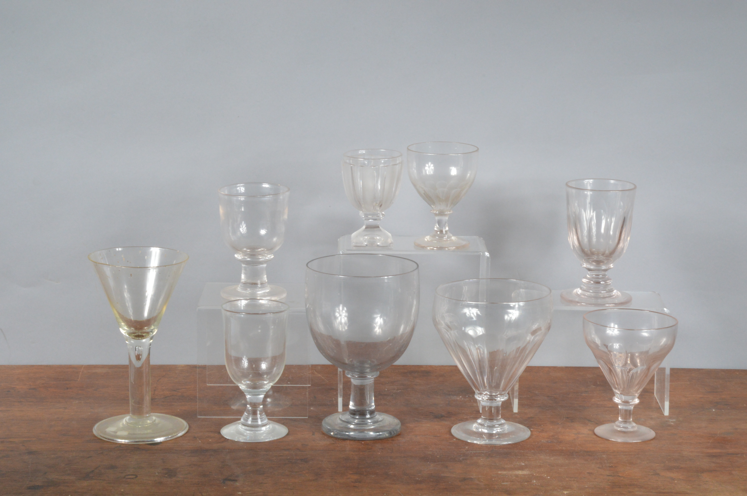 A collection of 19th century and later glass footed bowls and vases, some cut glass examples, many