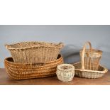 A collection of wicker items, comprising two large twin handled baskets, the largest 73cm in length,