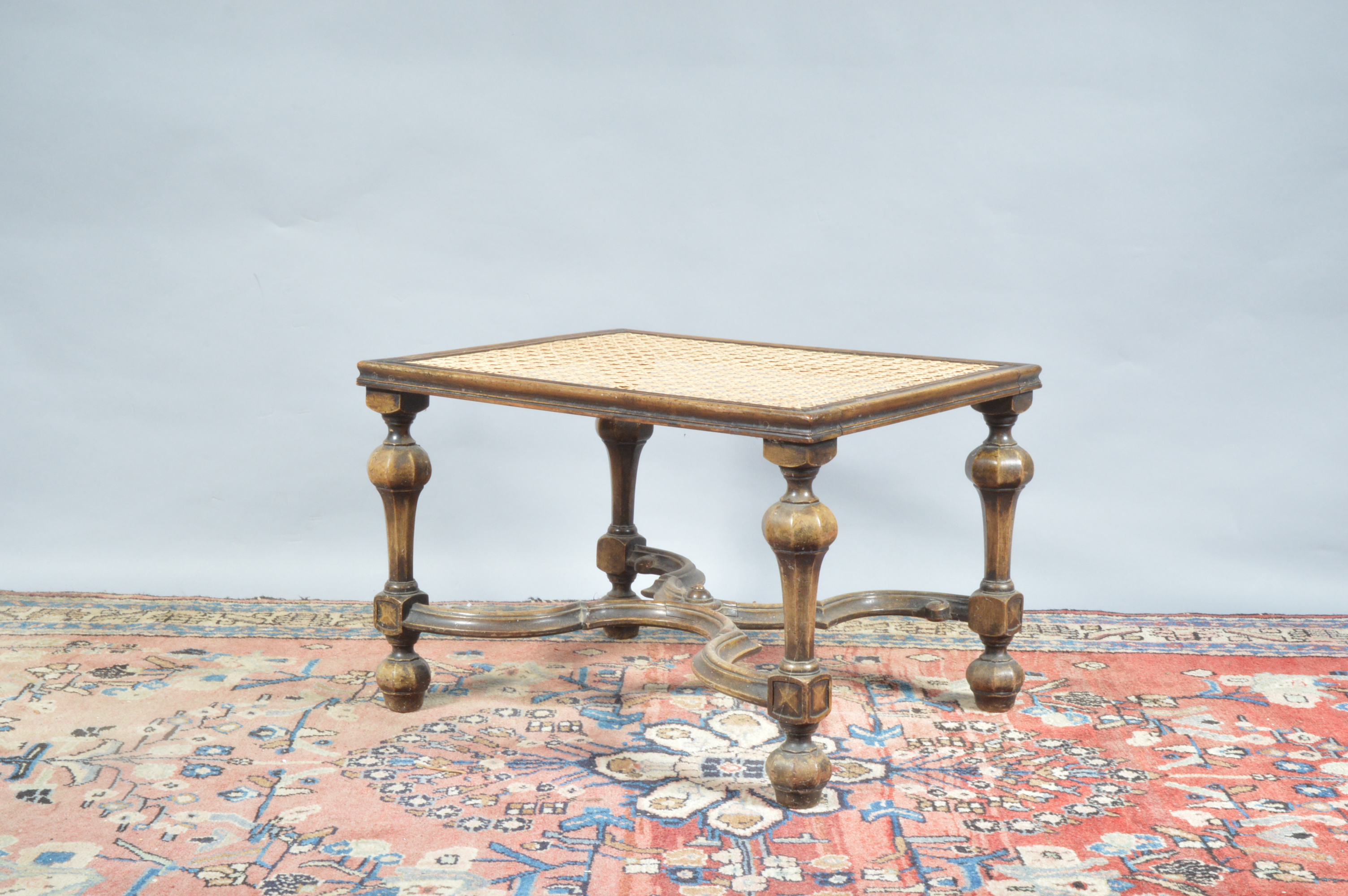 A 19th century continental possibly Italian footstool, newly caned top, raised on four turned - Image 2 of 3