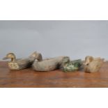 Four 19th century and later primitive decoy ducks, three wooden one sponge bodied example, hand