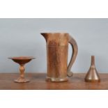 A 19th century ash treen handled jug, the handle loose from the body, a large chip to the base 22cm