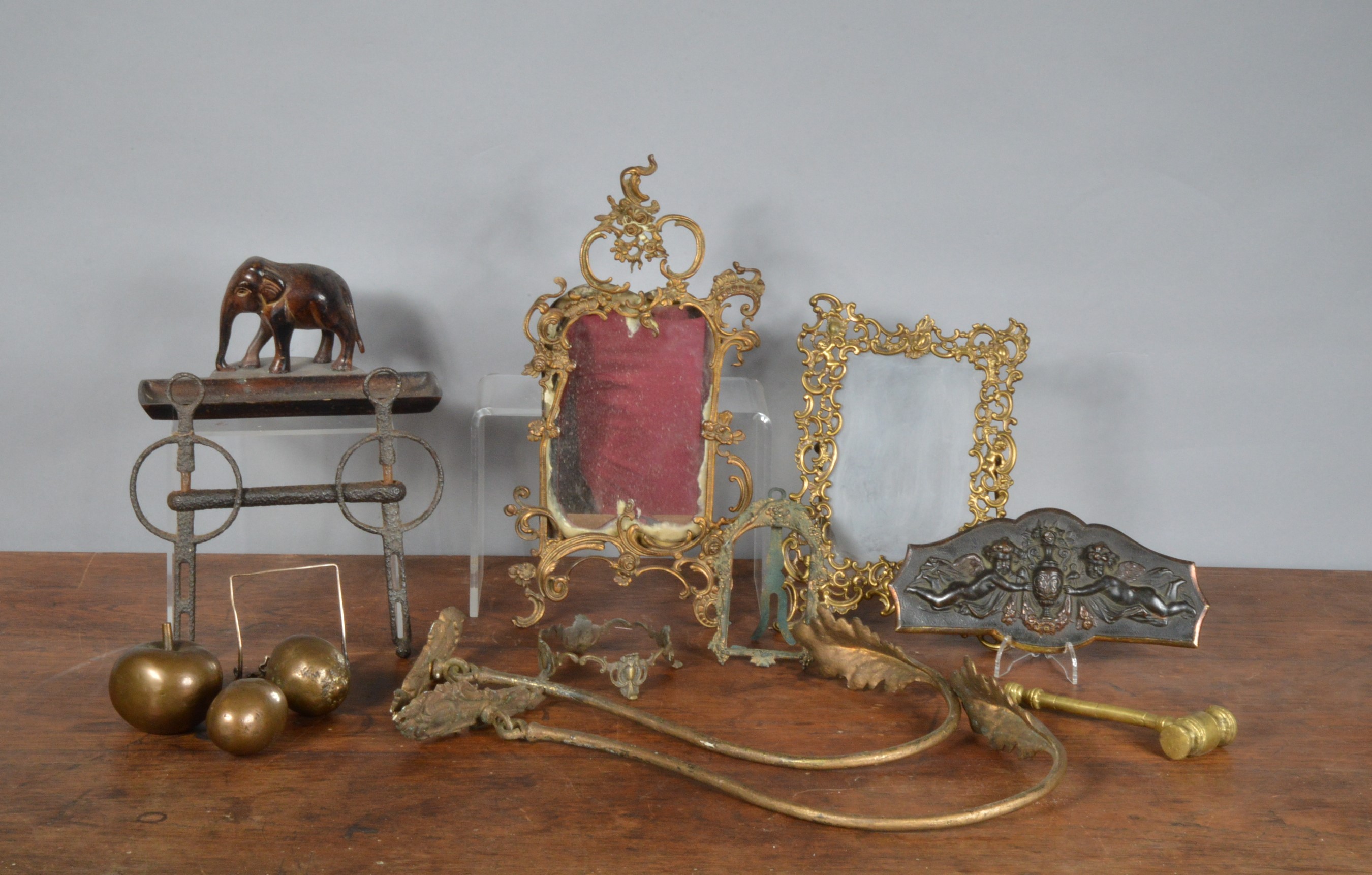 A collection of 19th century and later metal works of art, including three pieces of copper fruit,