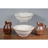 Two 19th century French faience white bowls, together with two Gres du Berry French stoneware