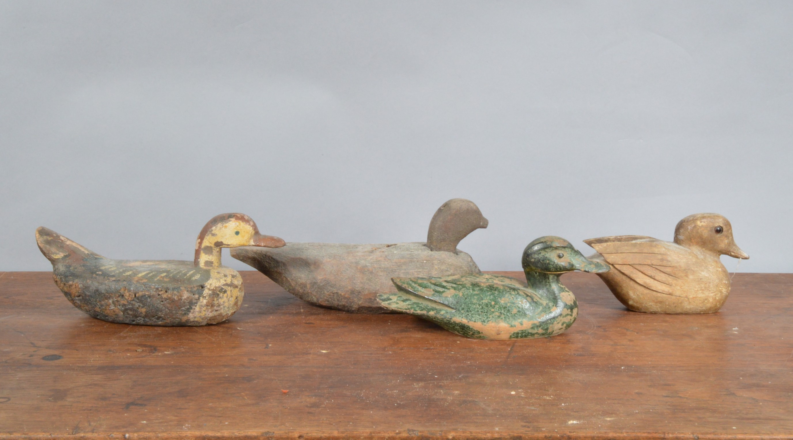 Four 19th century and later primitive decoy ducks, three wooden one sponge bodied example, hand - Image 2 of 2