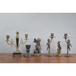 A pair of 19th century and later spelter cherub candlesticks, both 23cm high, two cherub sculptures,